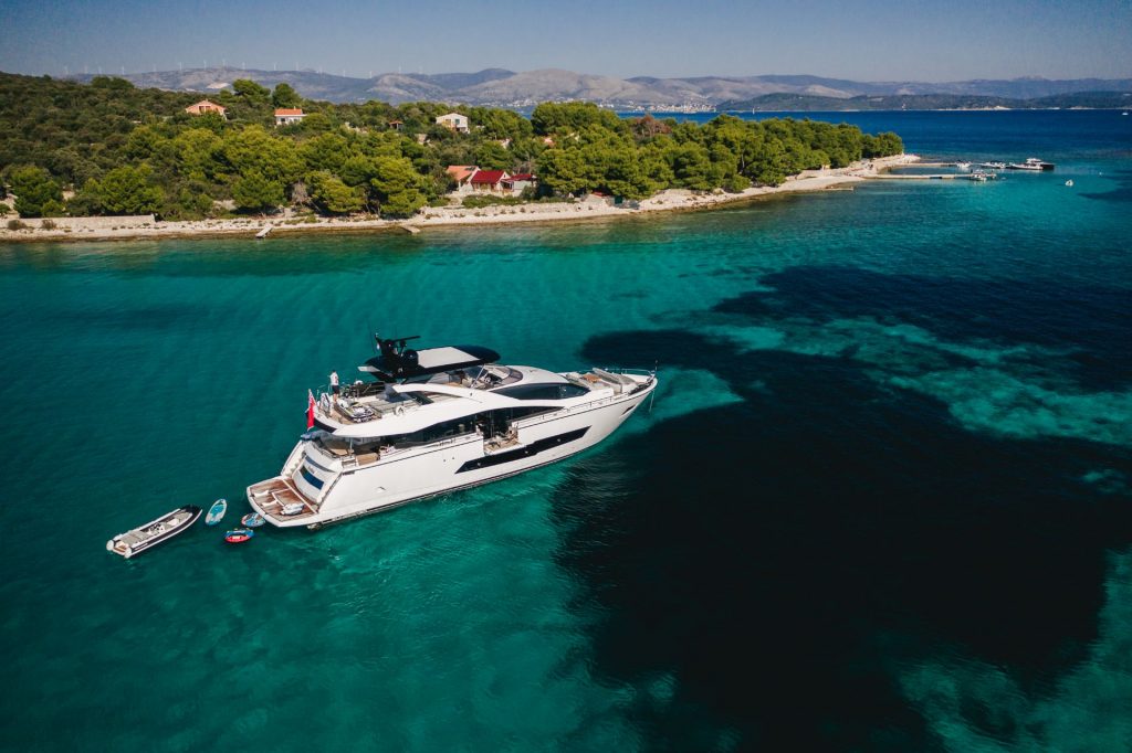 yacht anchored by the island