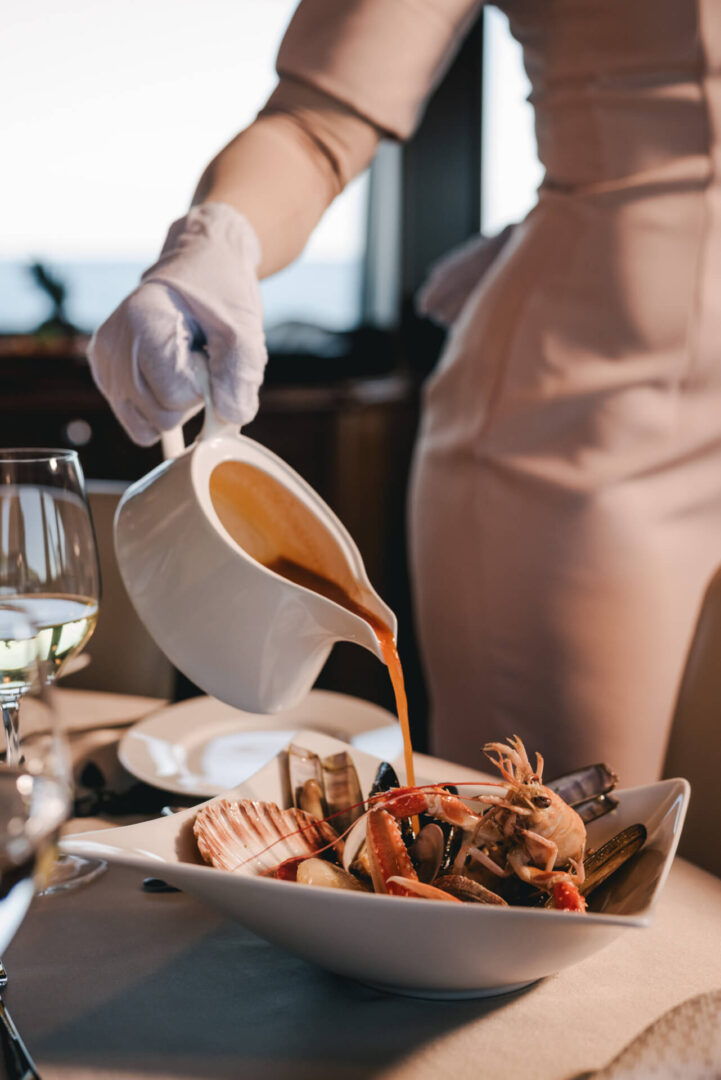 sunset dinner serving seafood on a yacht