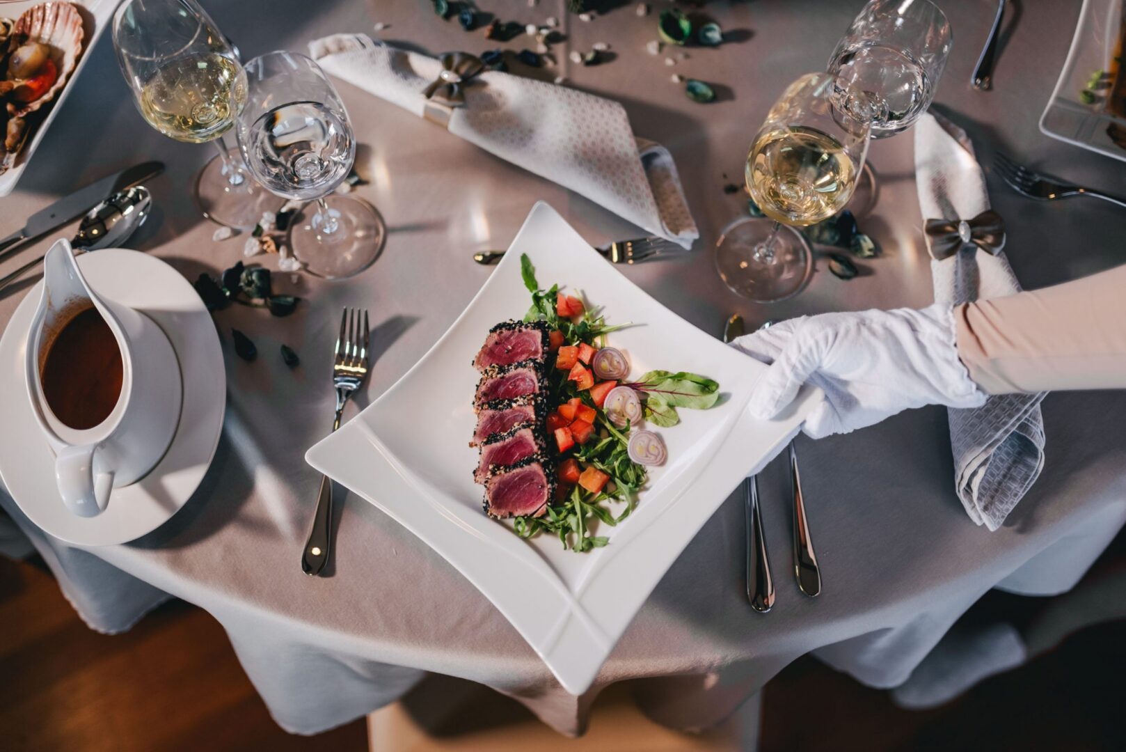 dining on the beach serving steak