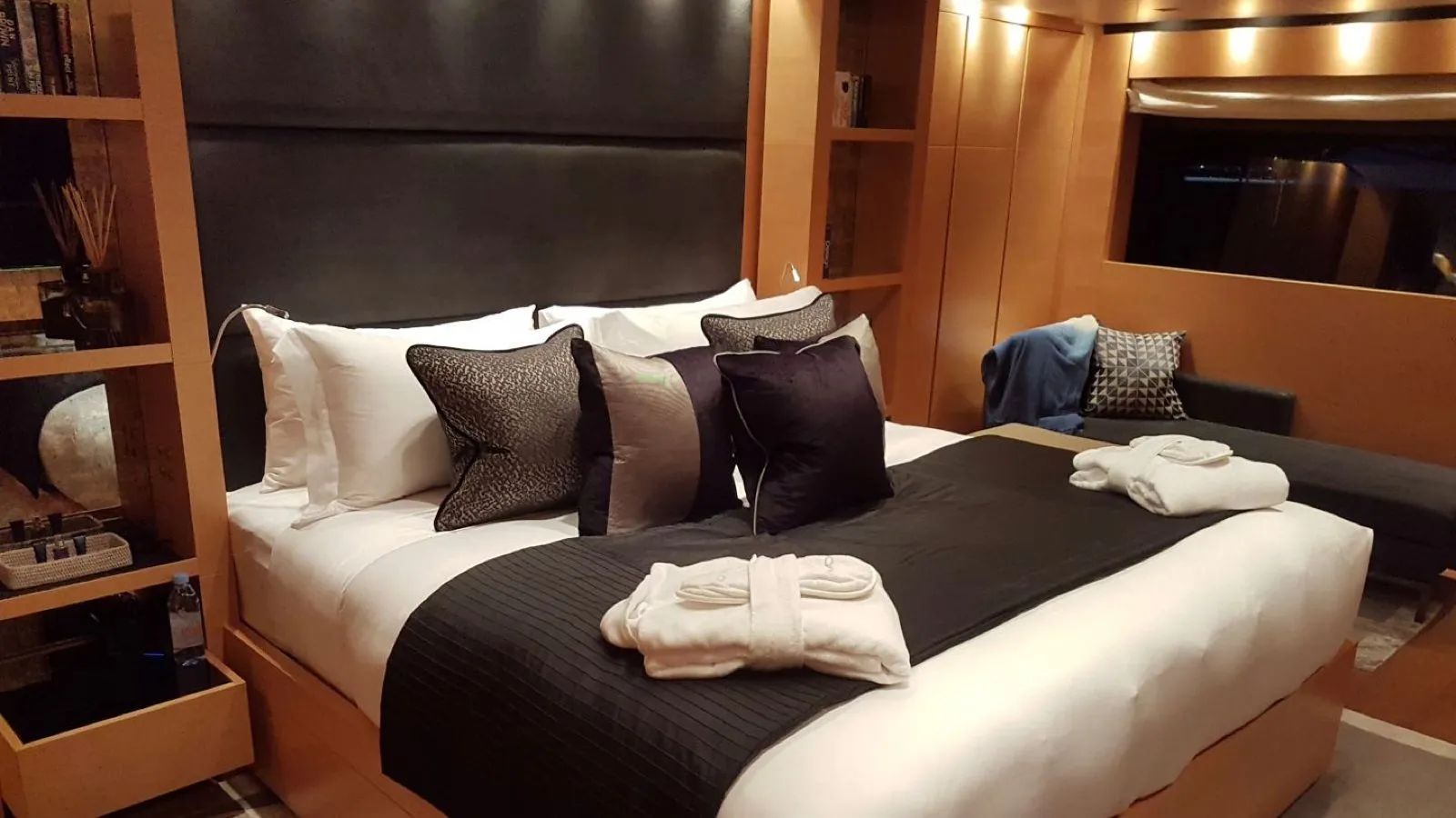 queen size bed in the yacht lower deck with cushions 