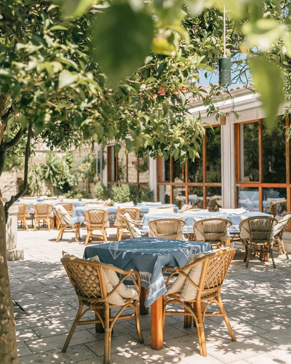 Yacht Charter in Vis tables under the citrus trees