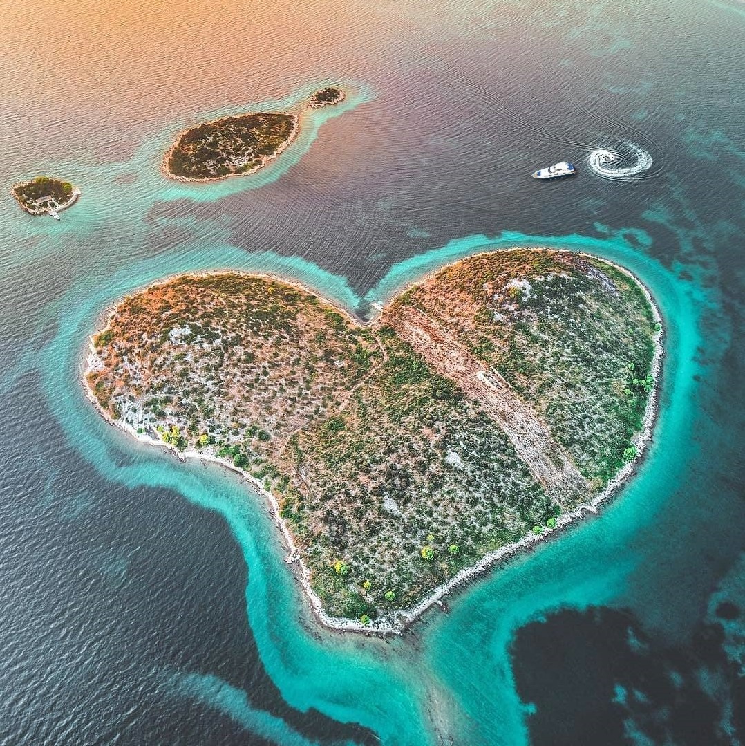 heart shaped island aerial view romantic yacht charter