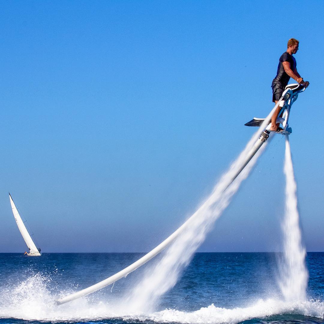 man on a jet water toys gliding in the air