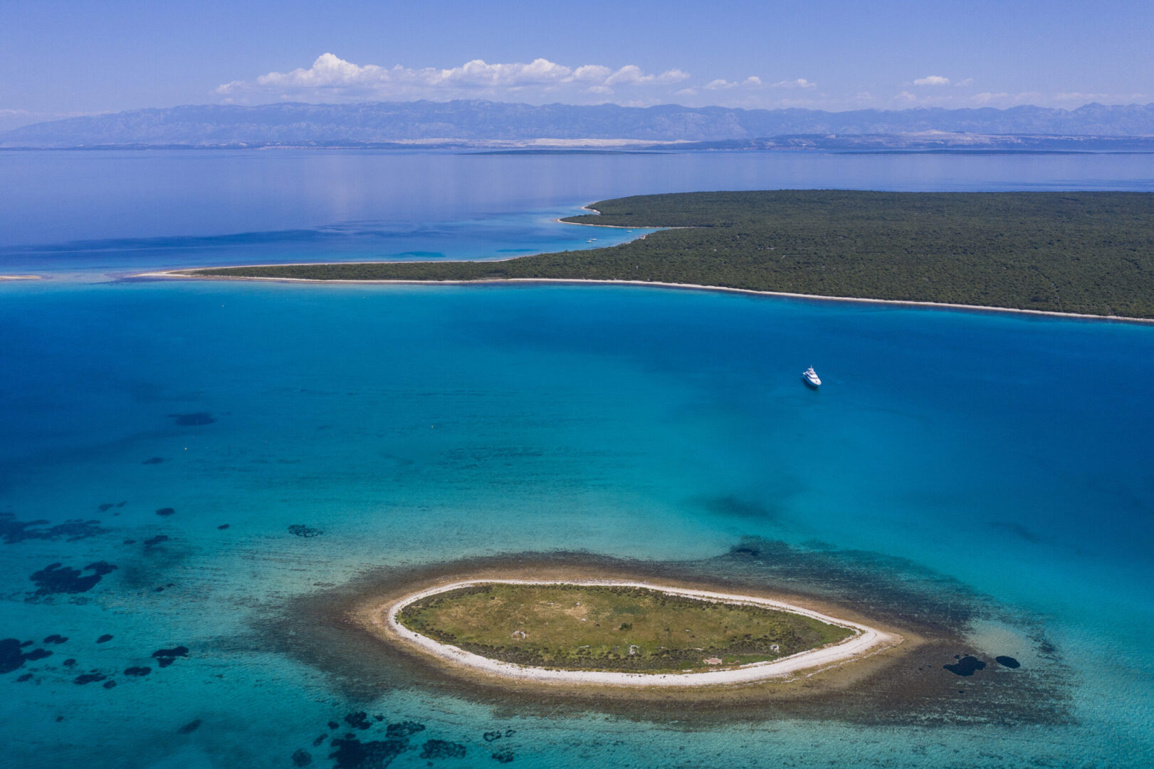 An incredible view of the Adriaitc sea and a yacht in the distance 