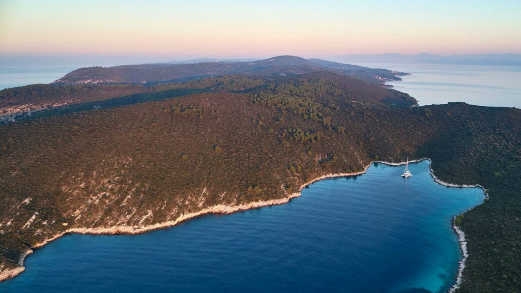 adriatic dragon catamaran yacht in the bay air view