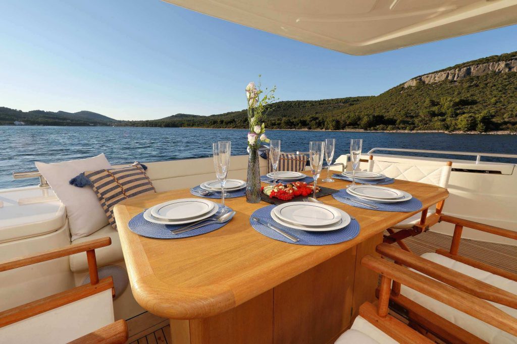 dominique yacht charter alfresco dining area with a table set