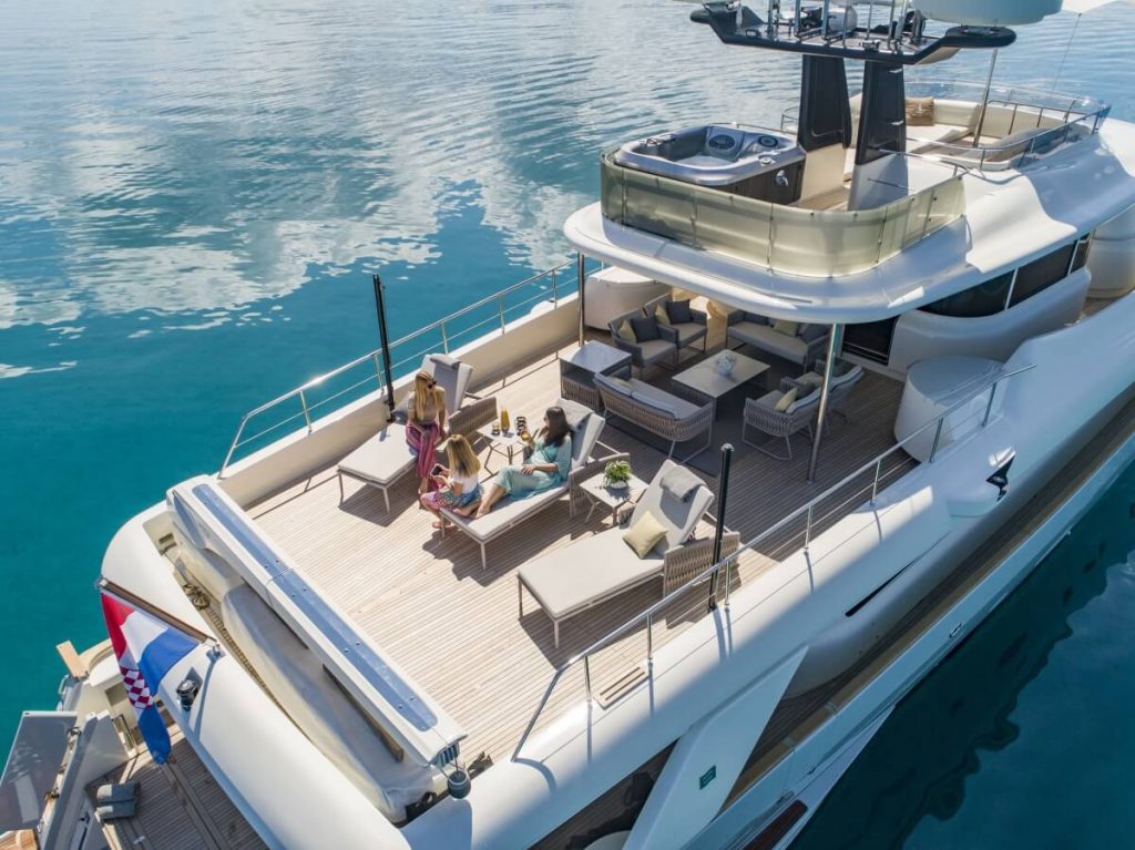 ena yacht charter guests on the upper aft sun loungers