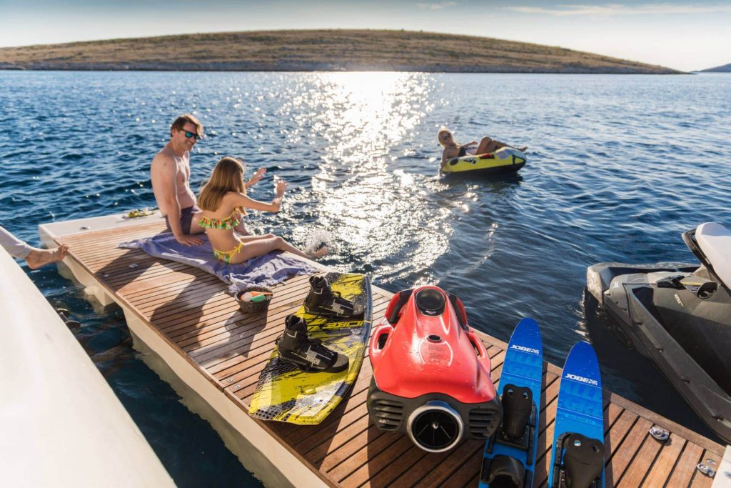 family with water toys by the casa yacht charter