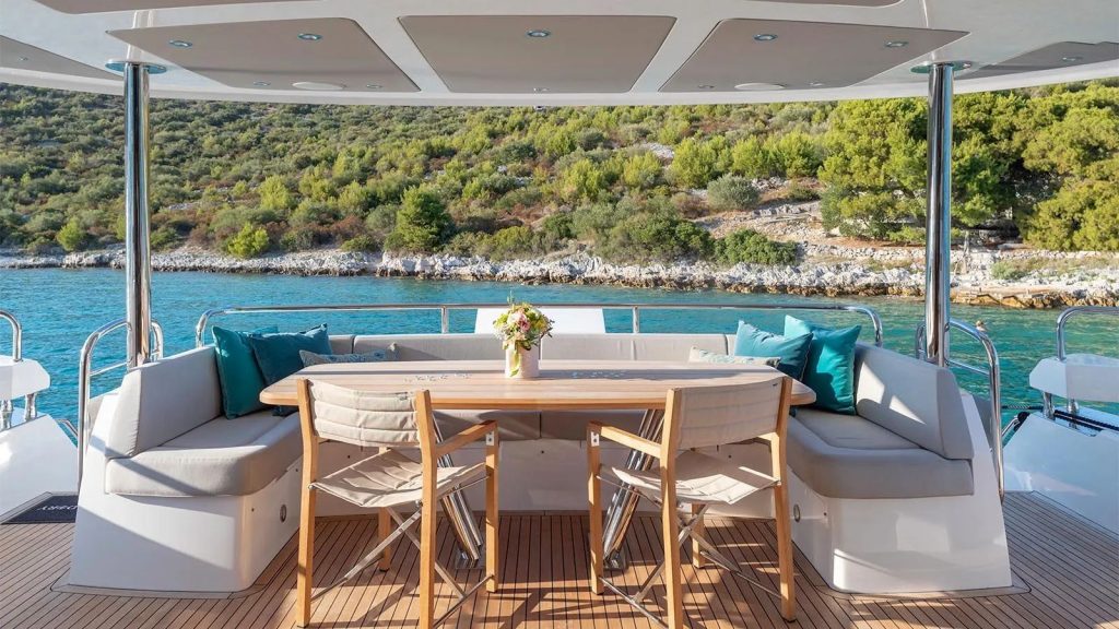 hunky dory yacht charter aft deck dining table