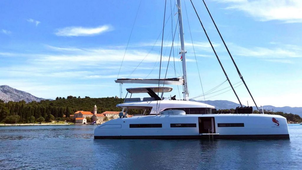 adriatic dragon catamaran yacht anchored by the croatian coast