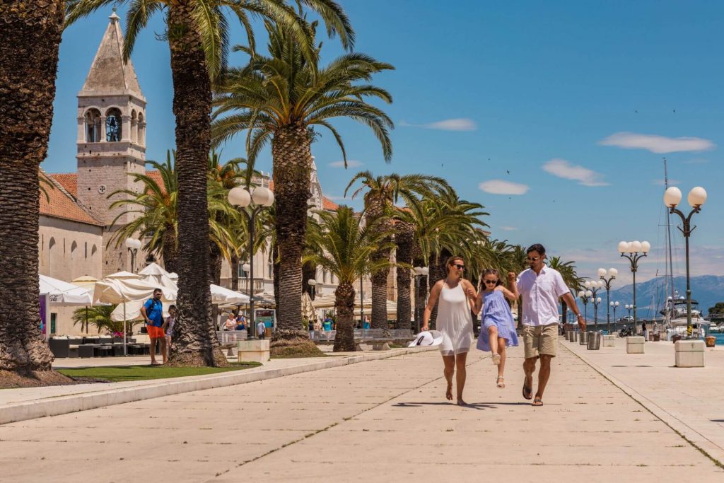 family walking on a Trogir shore