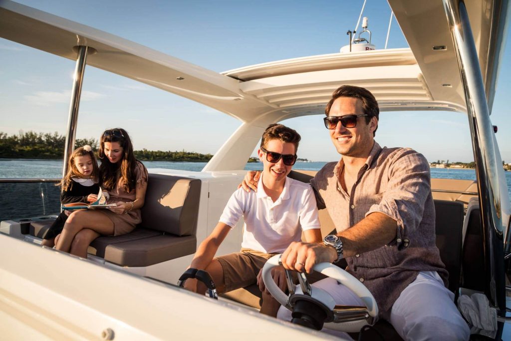 prestige 630 yacht charter family in a cockpit