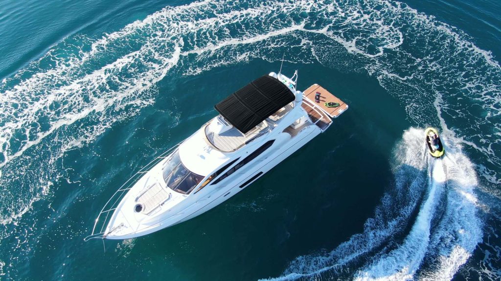 cardano yacht charter jetski cruising around the yacht