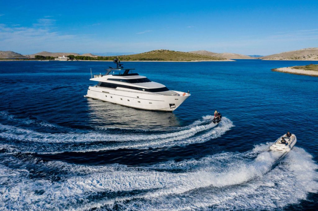 casa superyacht anchored in the sea with a jet ski around