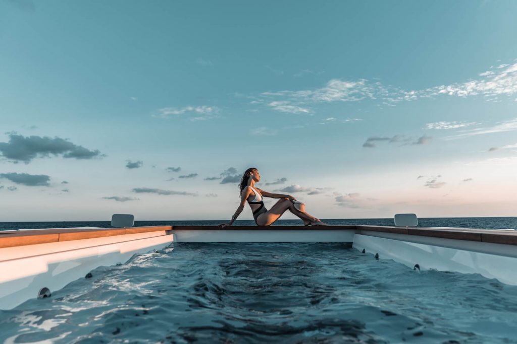 tatiana yacht charter lady sunbathing by the pool