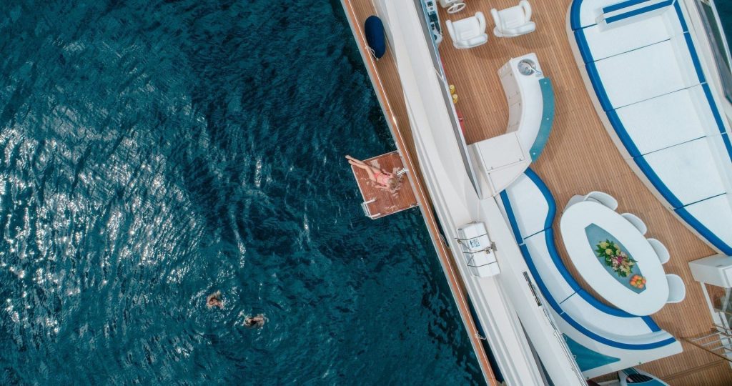 lady mura yacht charter sunbathing on a private terrace