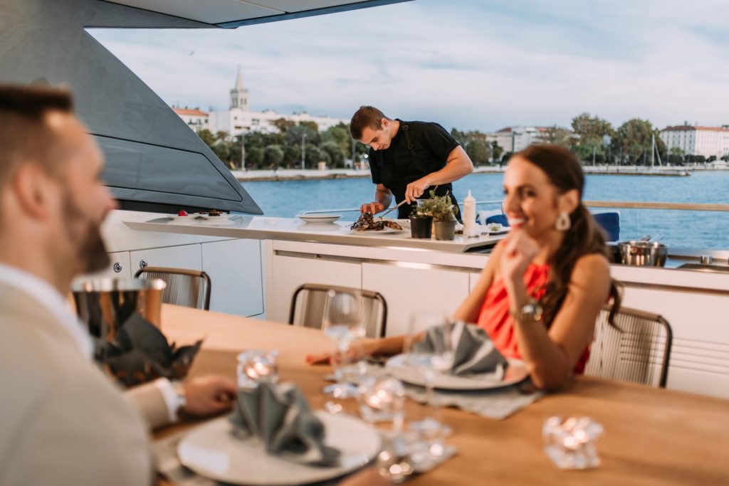 andiamo yacht charter chef preparing dinner for guests