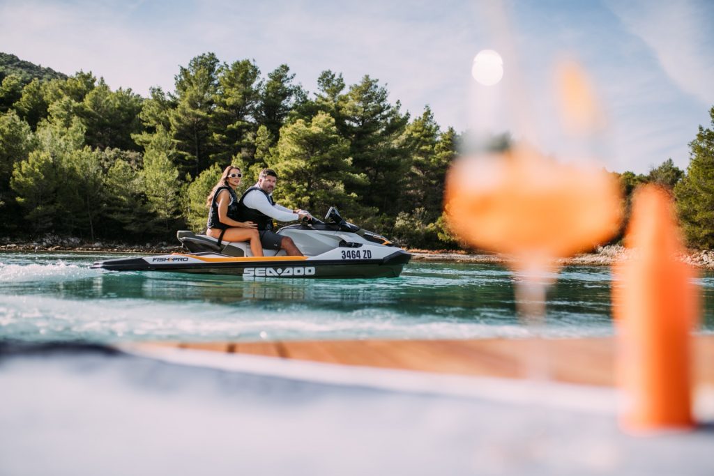 andiamo yacht charter captain and guest on a jet ski