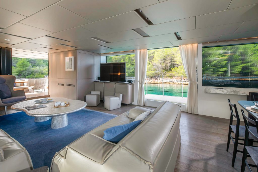 andiamo yacht charter salon with sofas and tv