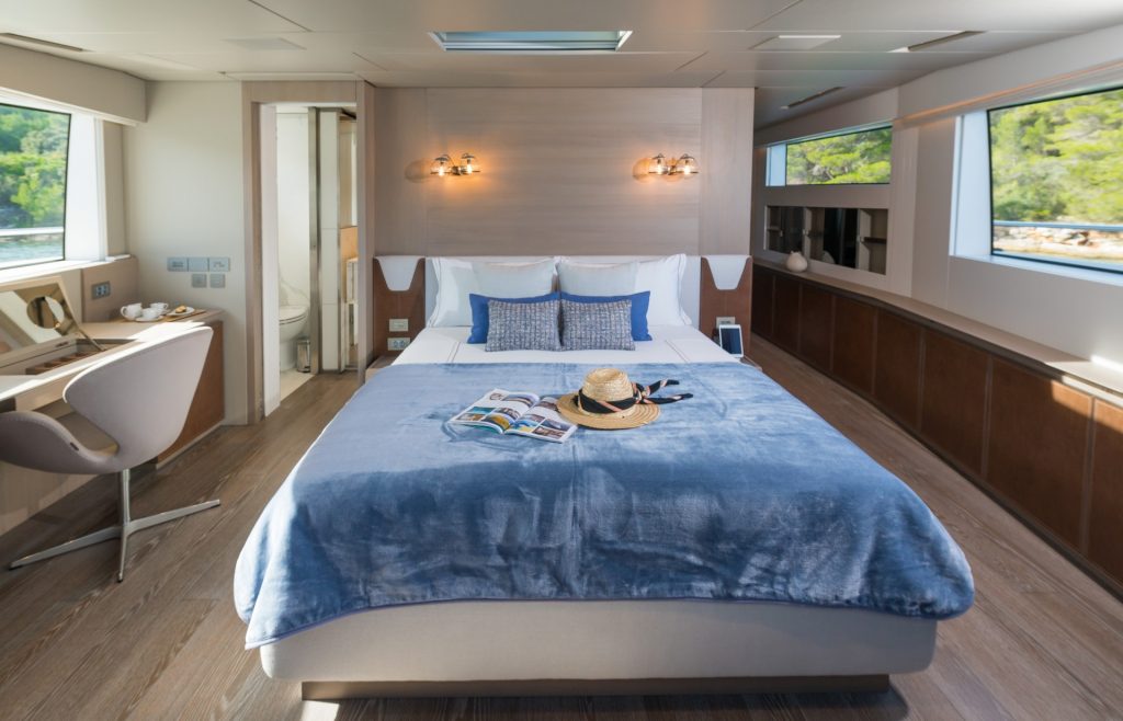 andiamo yacht charter bed with blue cover