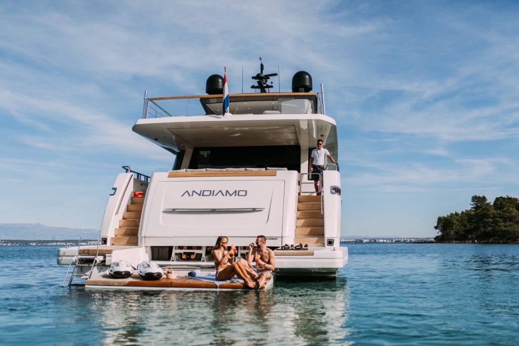 andiamo yacht charter guests on swimming platform