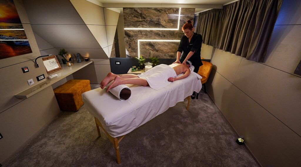 man getting a massage onboard a charter yacht