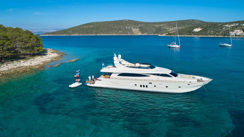 starboard side view yacht at anchor