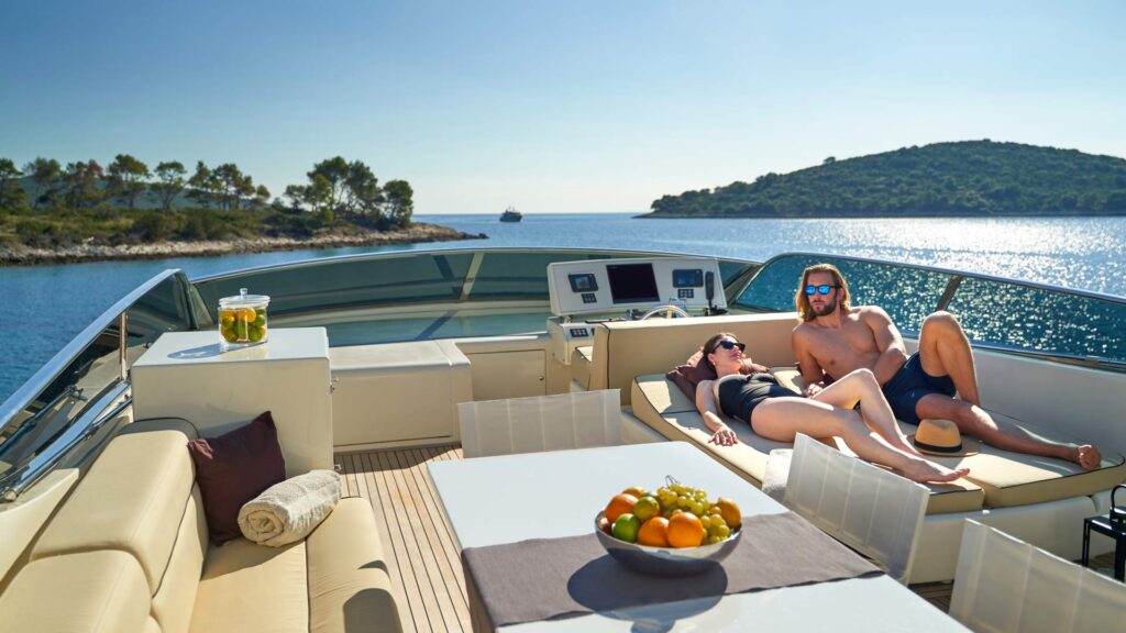 two people on the yacht sundeck