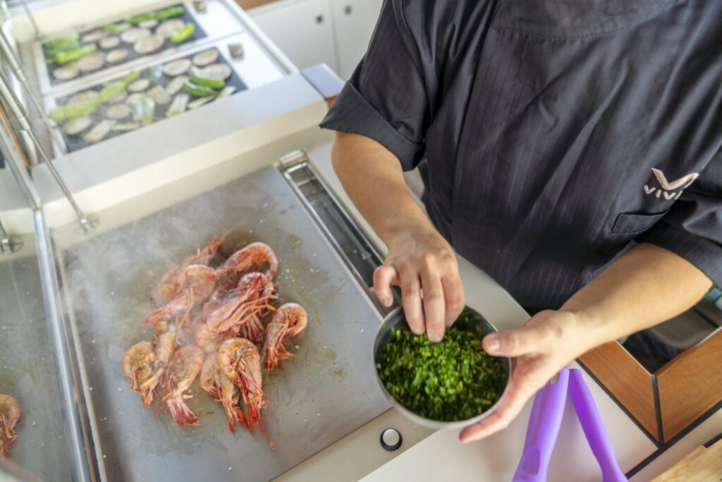 seasoning seafood on the yacht sundeck