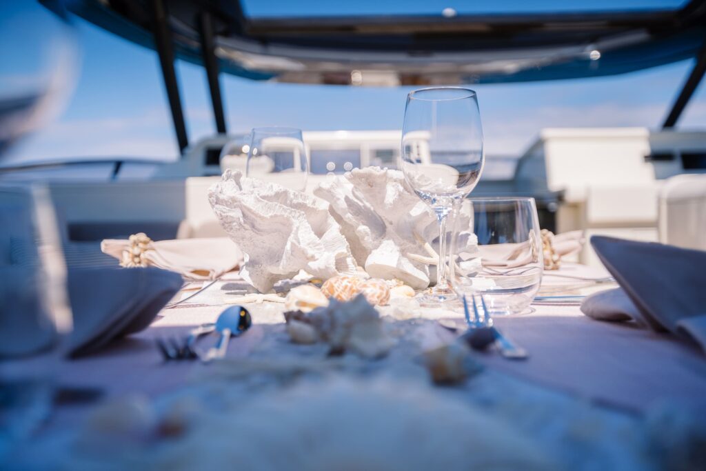 white dining setup with crystal glasses for wine