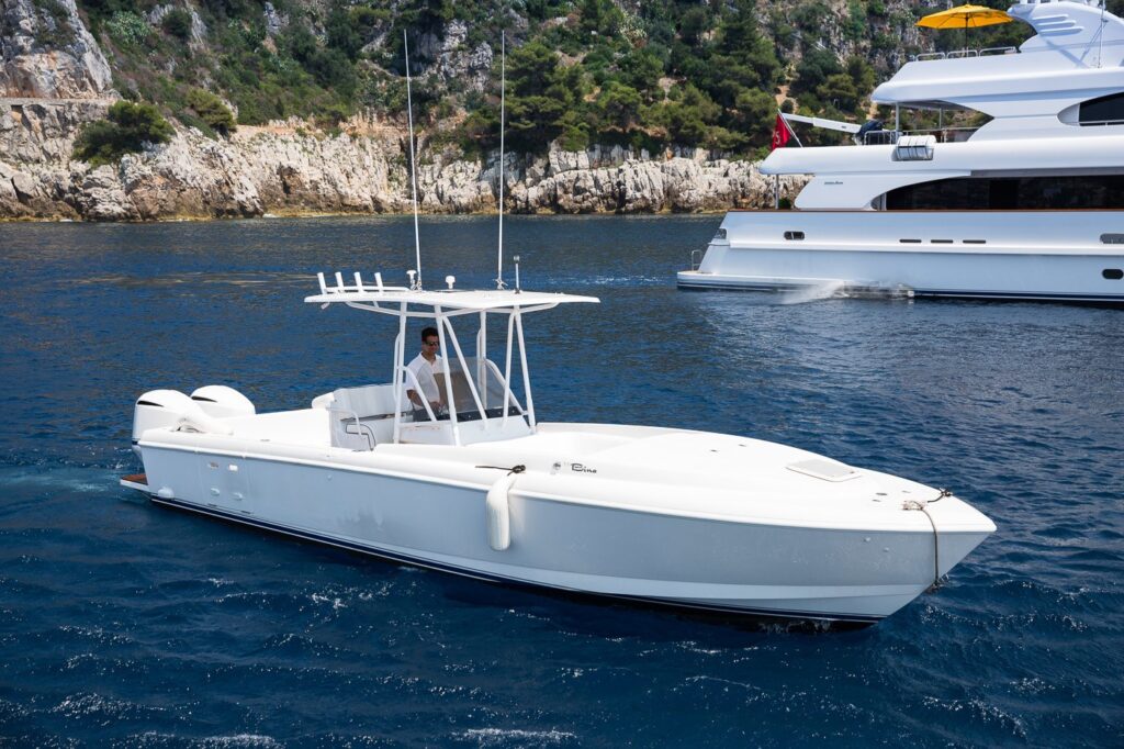 tender in the sea with the yacht in background