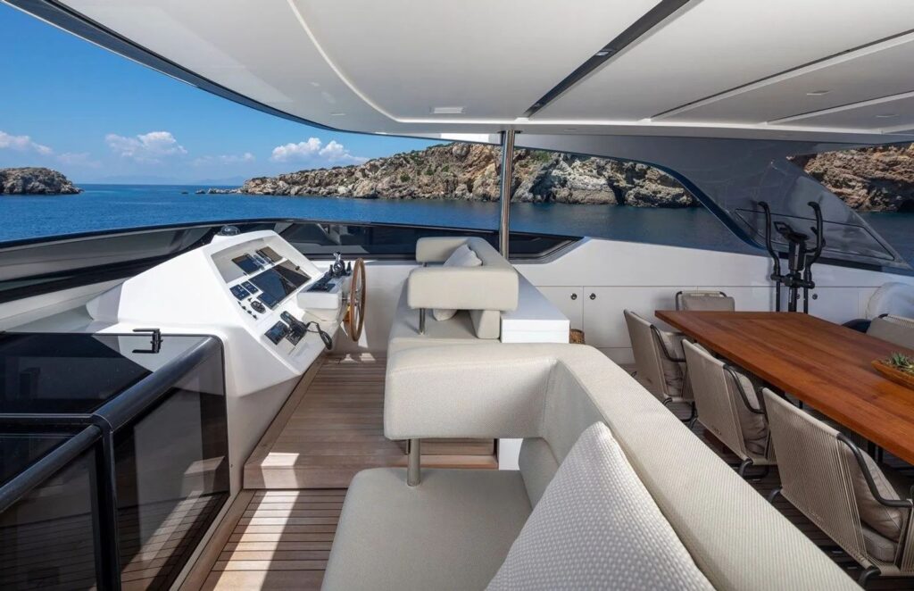 helm area on the yacht sundeck & a dining table