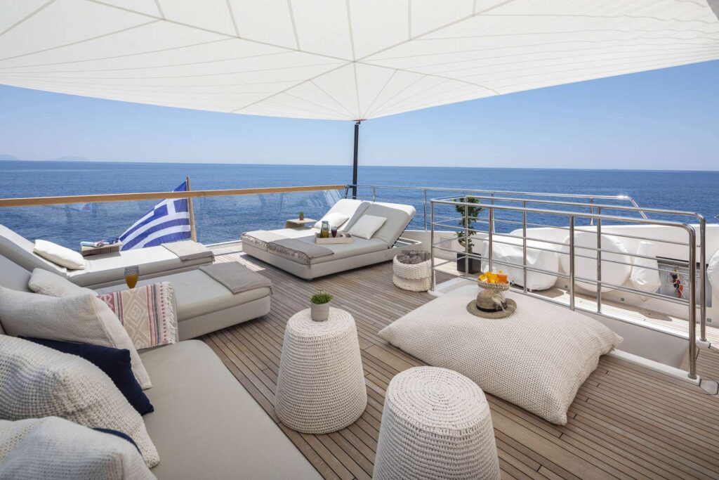 sundeck area with sun loungers & a bimini sunshade