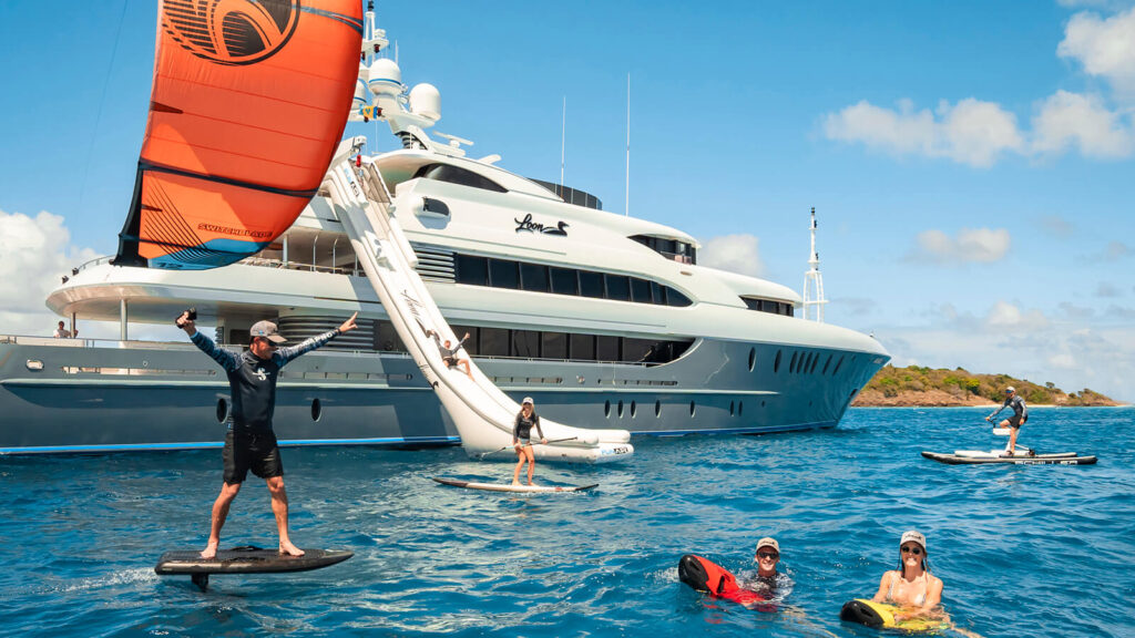 loon yacht charter guests with water toys